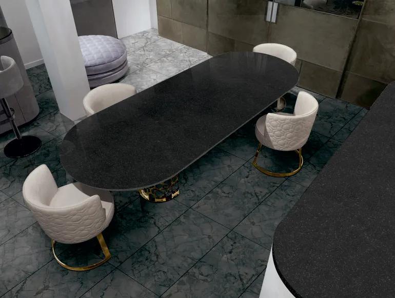 Elegant black countertop design with a glossy finish, featuring a modern dining table setup